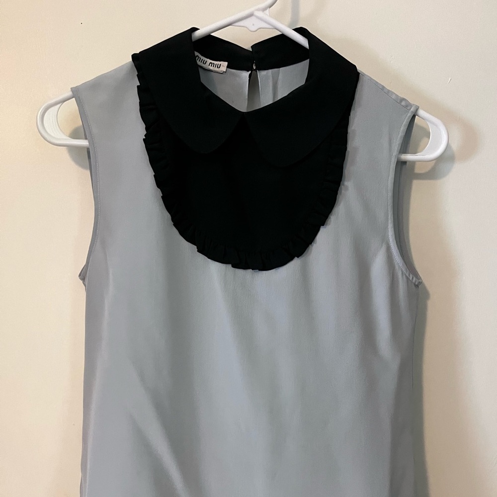 Beautiful Miu Miu light blue sleeveless blouse.